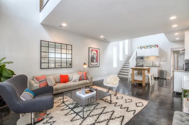 a living room with furniture and a table