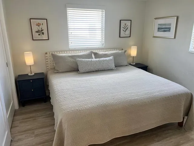 a bedroom with two beds and a couch
