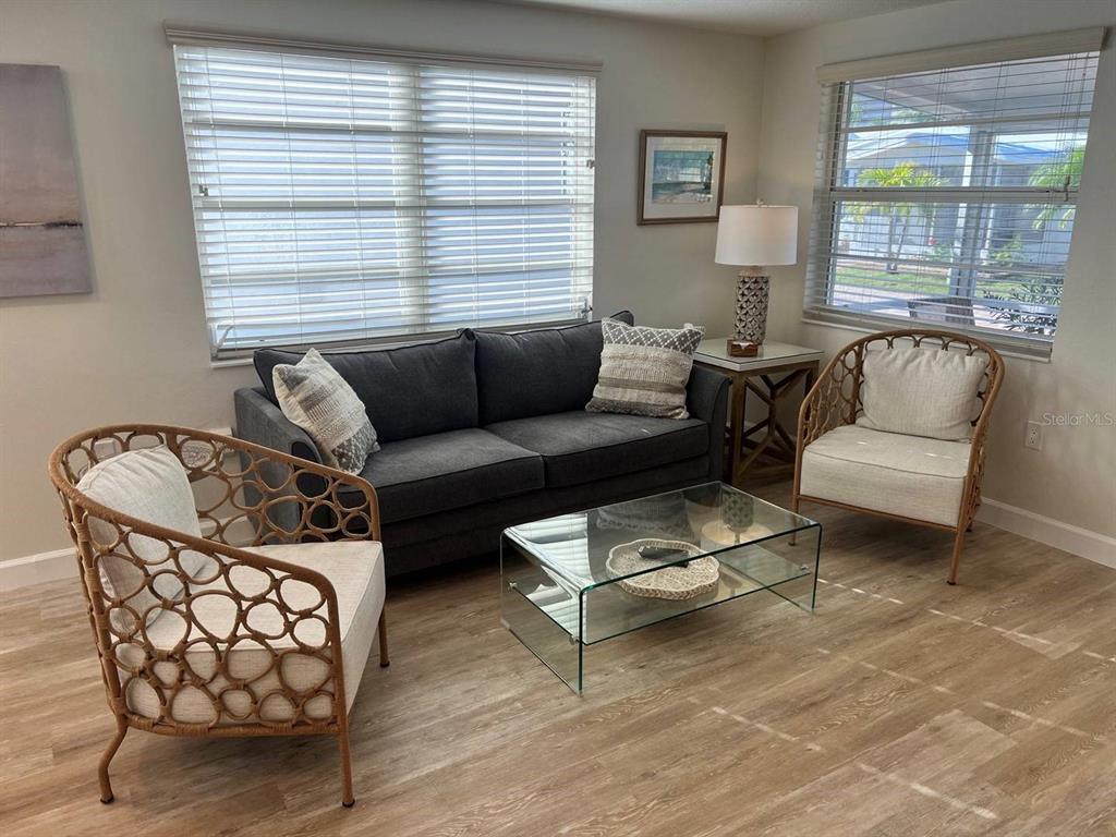 6020 Midnight Pass Road, Unit 45 Sarasota, FL 34242 - Photo 6 of 16 a living room with furniture and a window