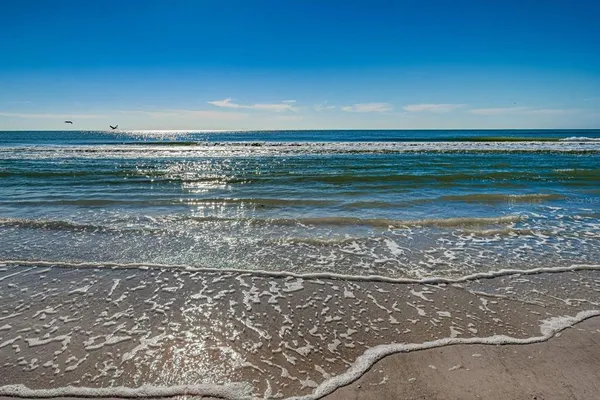 a view of beach and lake