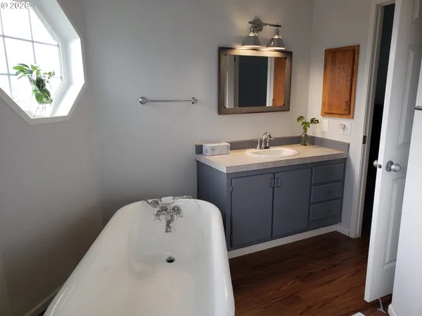 a en suite bathroom with a sink and mirror