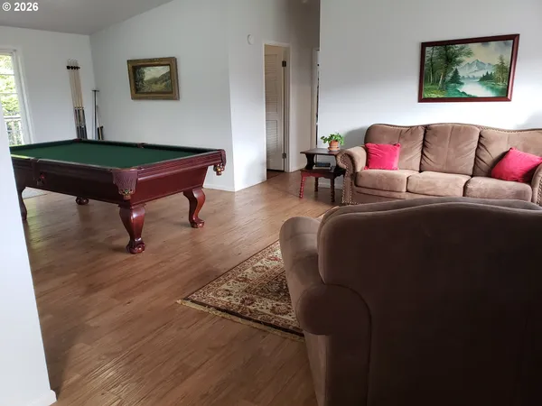 a living room with furniture and a table