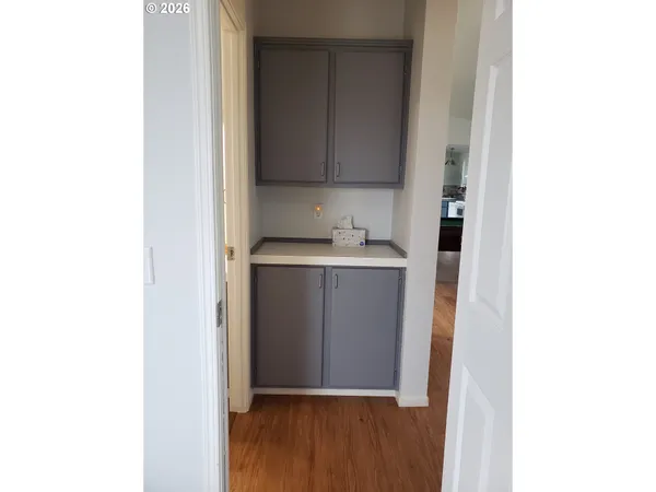 a room with a sink and a mirror