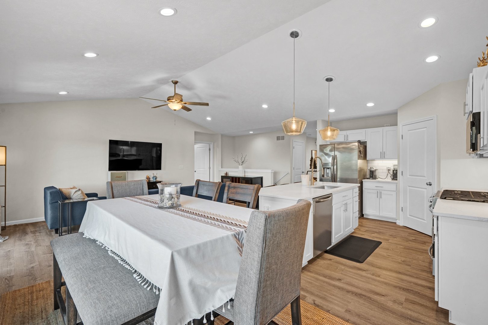 277 Cassidy Road Normal, IL 61761 - Photo 12 of 42 a kitchen with stainless steel appliances kitchen island granite countertop a sink refrigerator and microwave