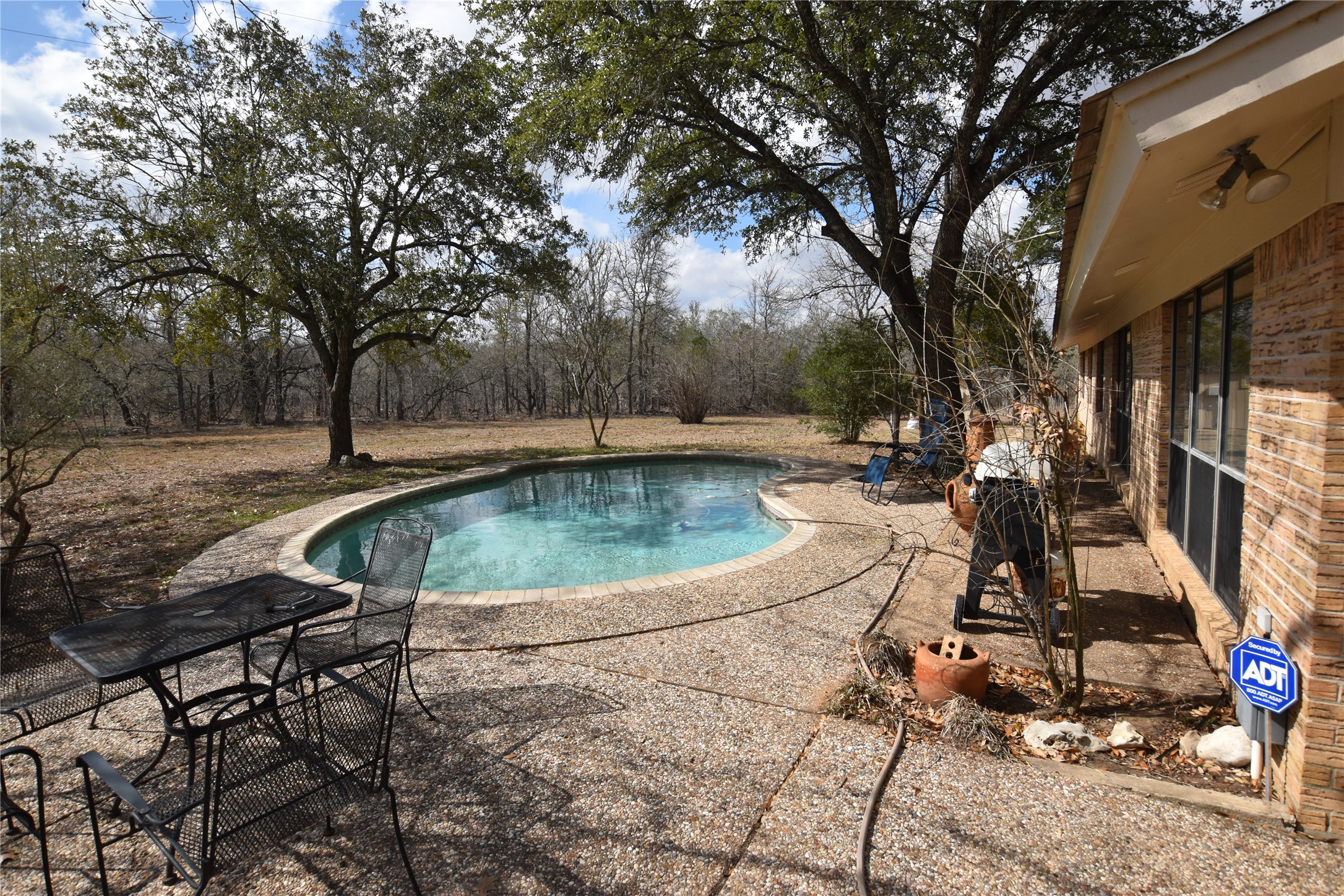 687 Fm 812 Road Red Rock, TX 78662 - Photo 21 of 40 Outdoor pool featuring a patio area