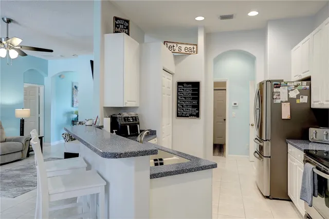 a bedroom with a bed and flat screen tv