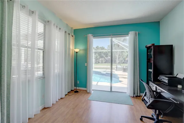 a bedroom with a large bed and a window