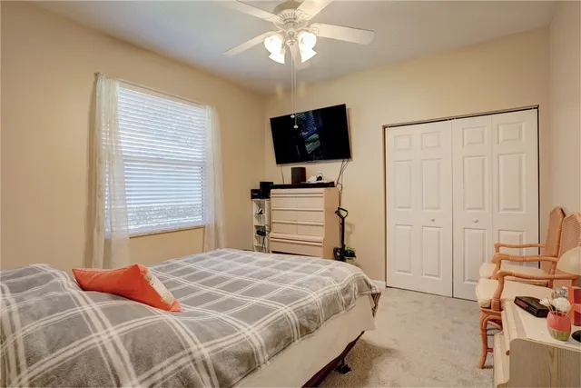 a front view of a house with garden and plants
