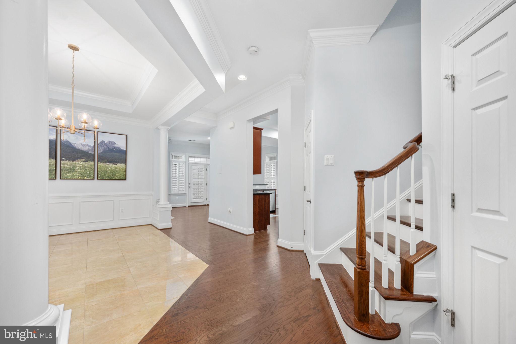6044 Masondale Road Alexandria, VA 22315 - Photo 13 of 64 a view of a livingroom with wooden floor and stairs