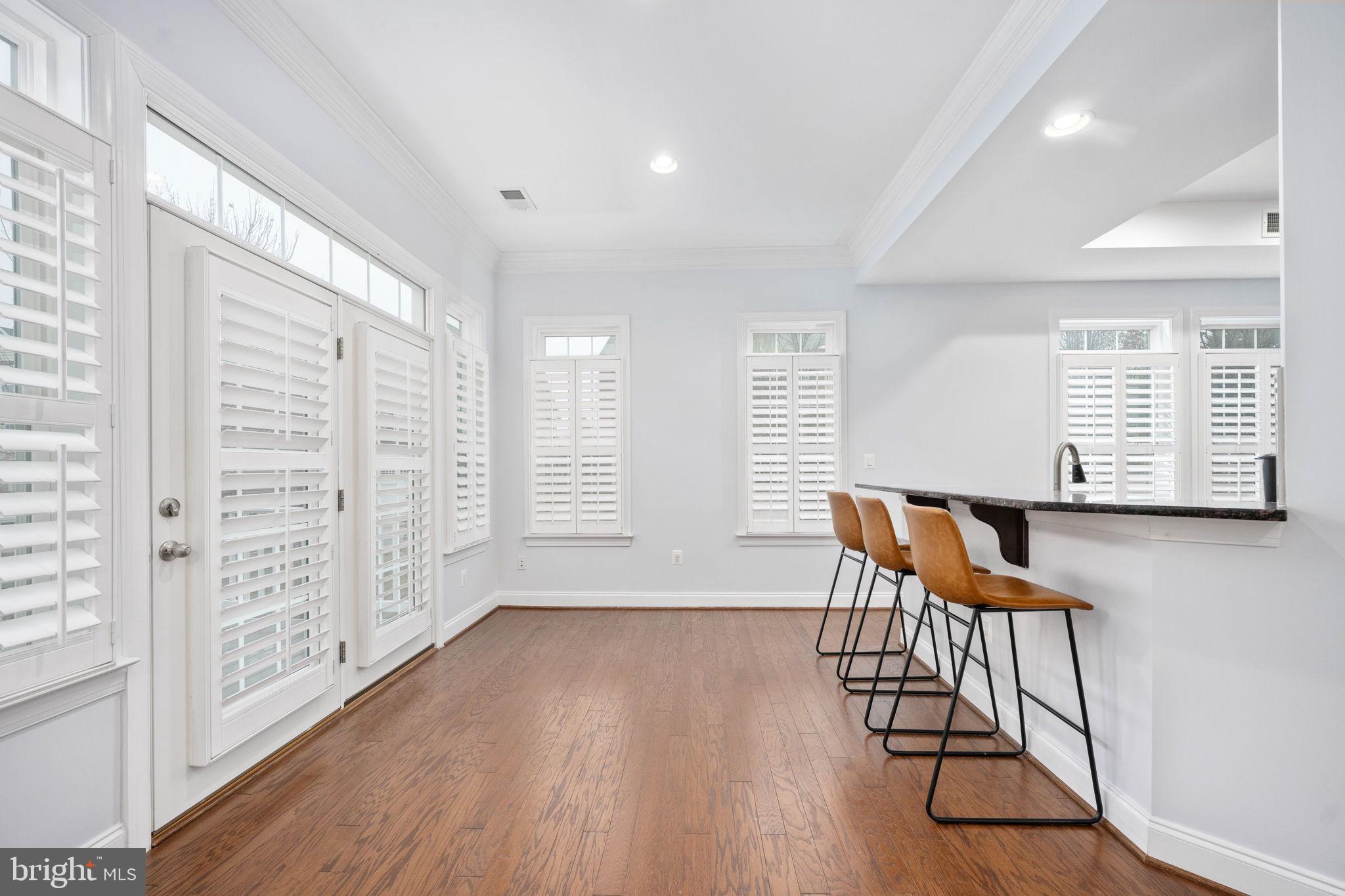 6044 Masondale Road Alexandria, VA 22315 - Photo 17 of 64 wooden floor in an empty room with a window