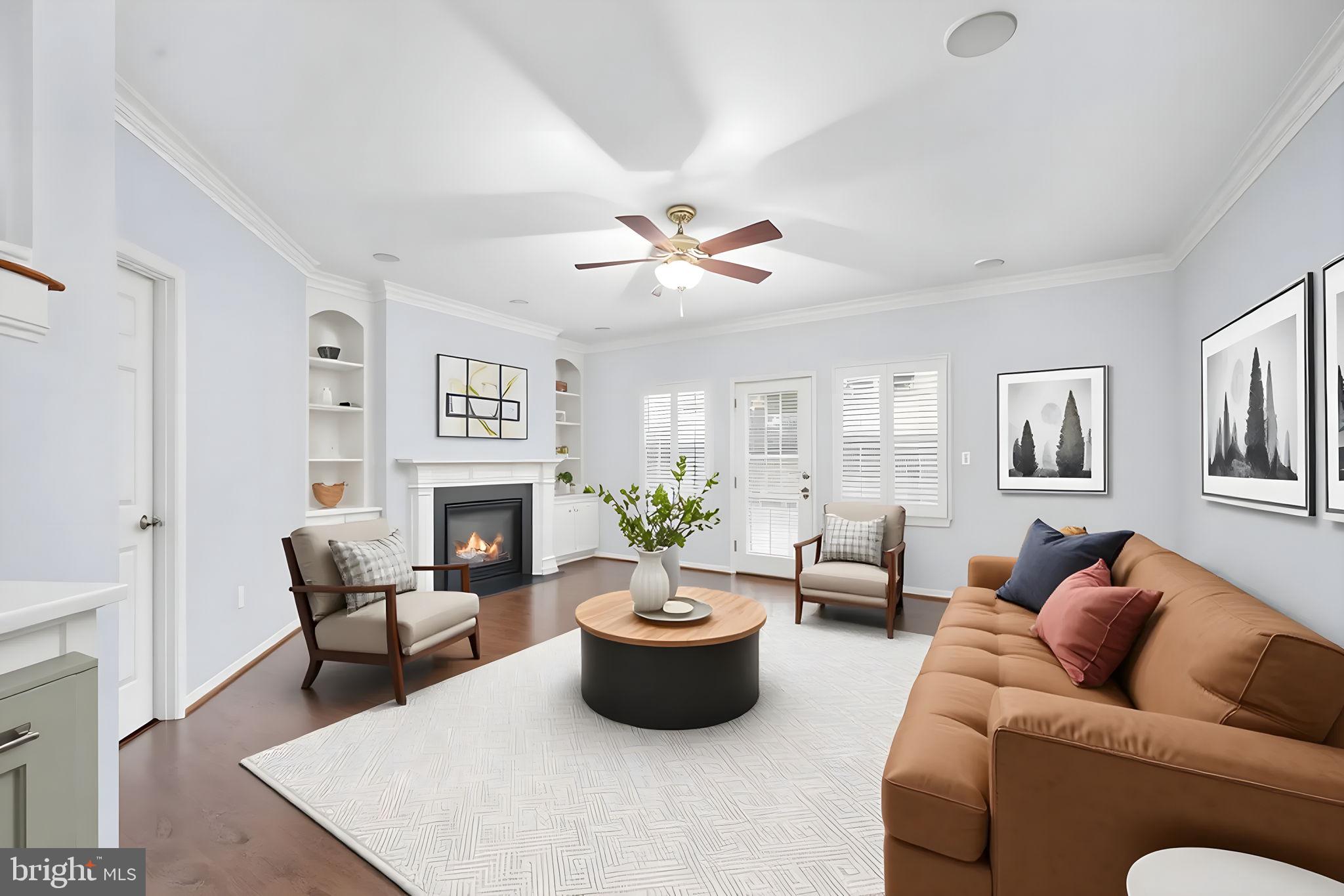 6044 Masondale Road Alexandria, VA 22315 - Photo 28 of 64 a living room with furniture a fireplace and a potted plant