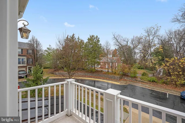 a bathroom with a granite countertop sink mirror and a bathtub