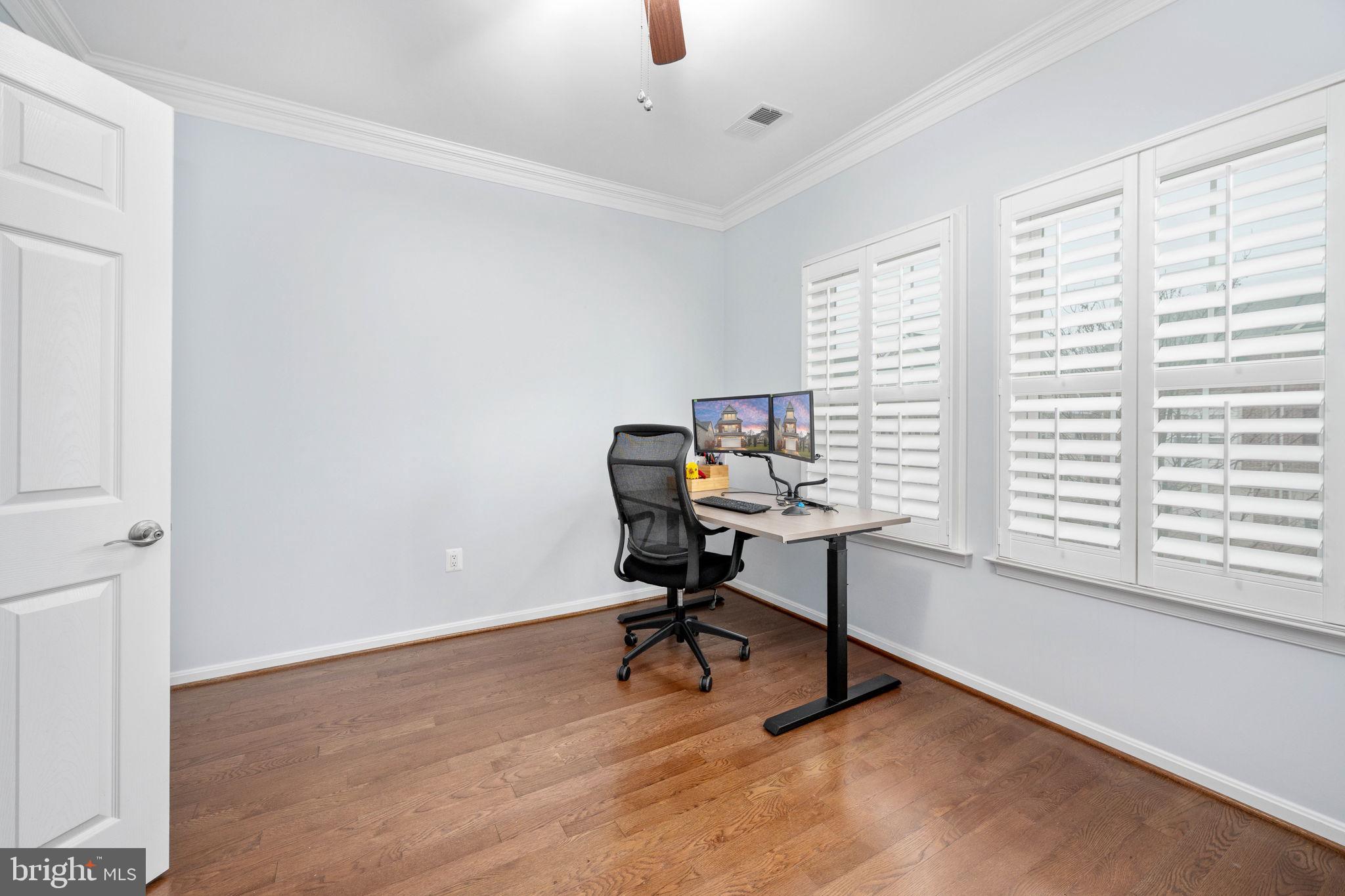 6044 Masondale Road Alexandria, VA 22315 - Photo 46 of 64 a view of a workspace with furniture and a window