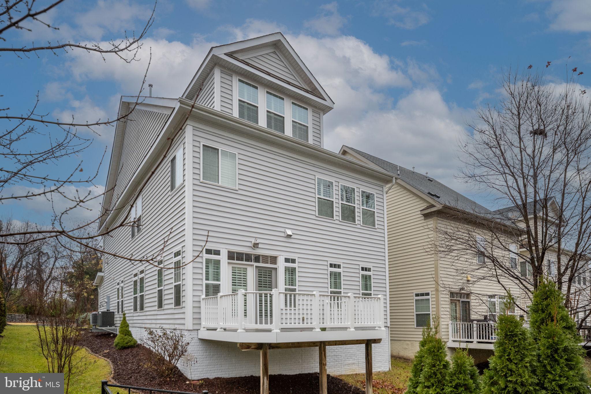6044 Masondale Road Alexandria, VA 22315 - Photo 56 of 64 a front view of a house with a garden