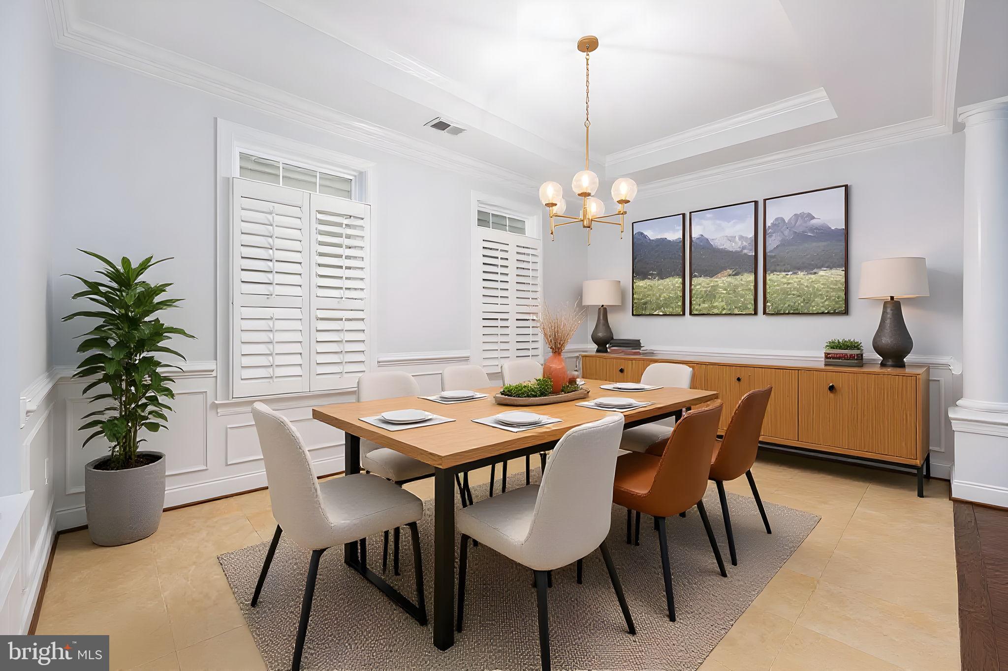 6044 Masondale Road Alexandria, VA 22315 - Photo 8 of 64 a dining room with furniture potted plants and wooden floor