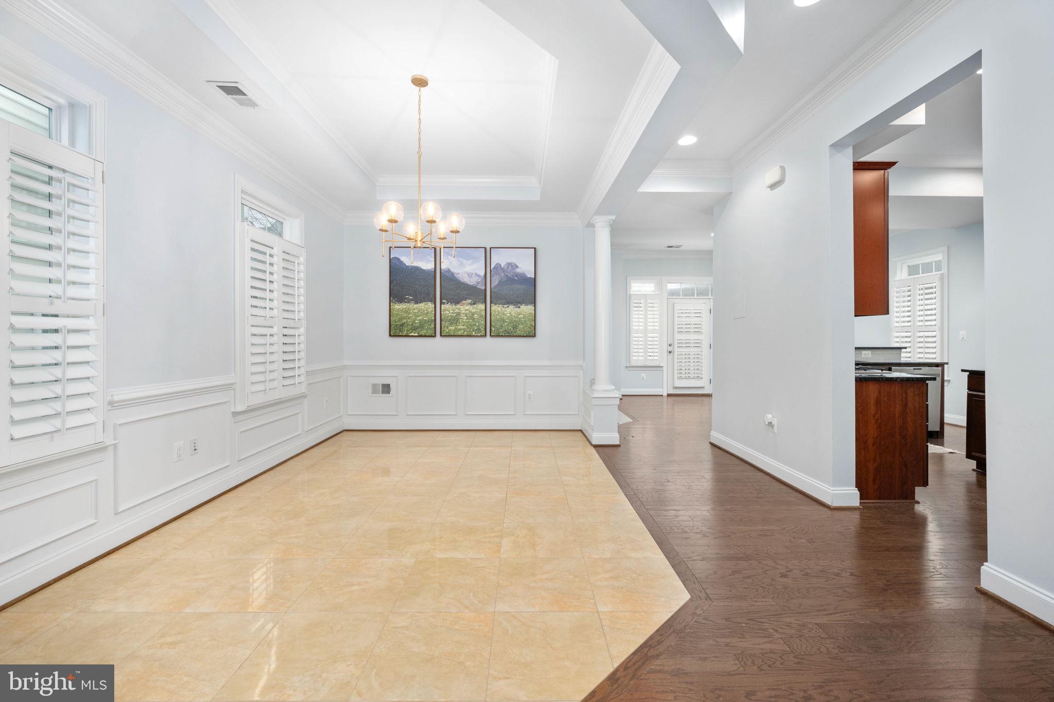 6044 Masondale Road Alexandria, VA 22315 - Photo 10 of 64 an empty room with wooden floor and windows