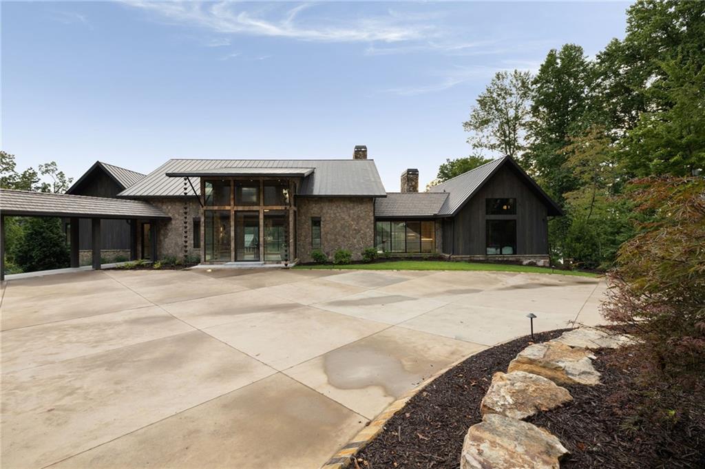 725 Rocky Point Drive Morganton, GA 30560 - Photo 23 of 157 a front view of a house with a yard and garage