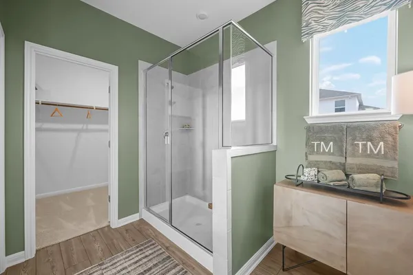 a bathroom with a granite countertop toilet sink and shower