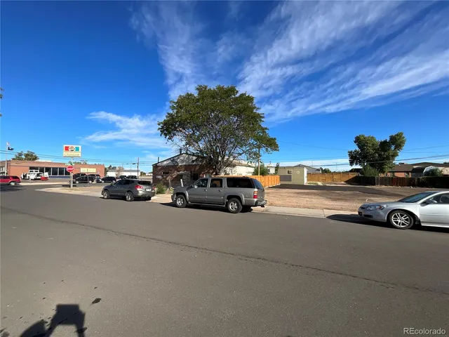 a view of street with parked cars