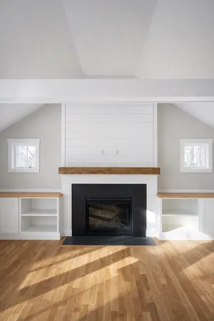 a kitchen with a sink cabinets and window