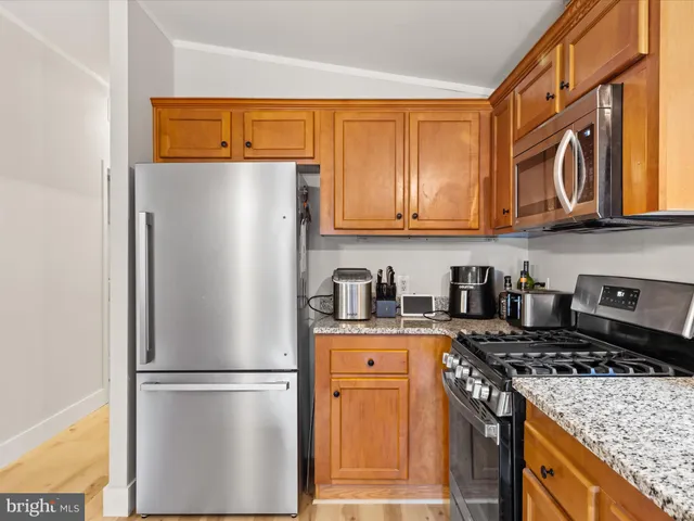 a white refrigerator freezer sitting inside of a kitchen