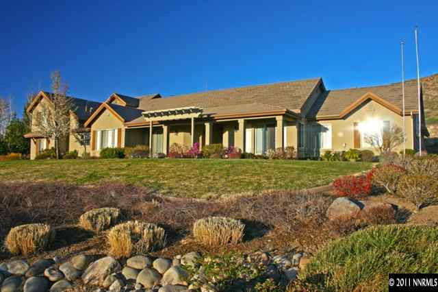 920 Schellbourne Road Reno, NV 89511 - Photo 1 of 13 a front view of a house with garden