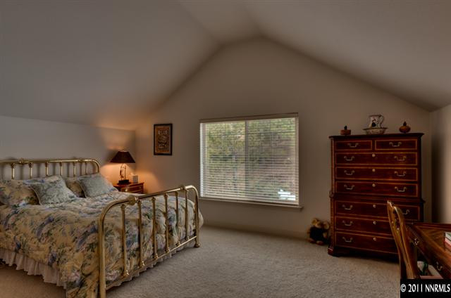 920 Schellbourne Road Reno, NV 89511 - Photo 11 of 13 a bedroom with a bed and a window