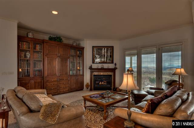 920 Schellbourne Road Reno, NV 89511 - Photo 2 of 13 a living room with furniture and a fireplace