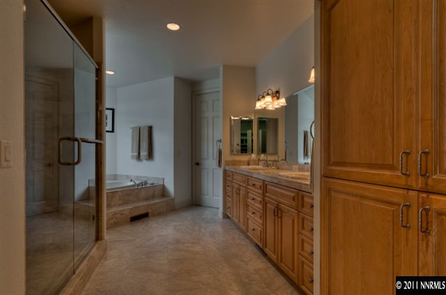 920 Schellbourne Road Reno, NV 89511 - Photo 8 of 13 a bathroom with a double vanity sink and mirror