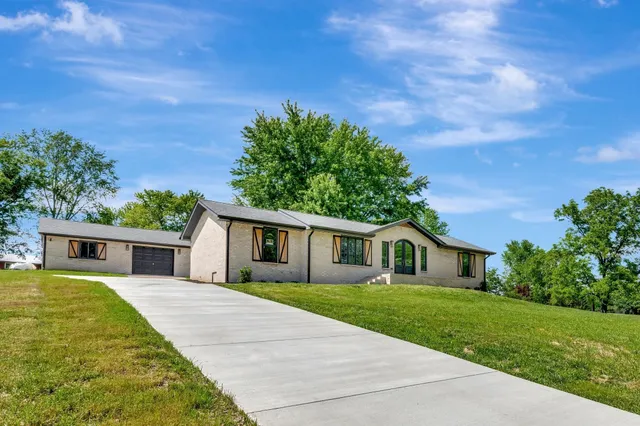 a house with garden in front of it