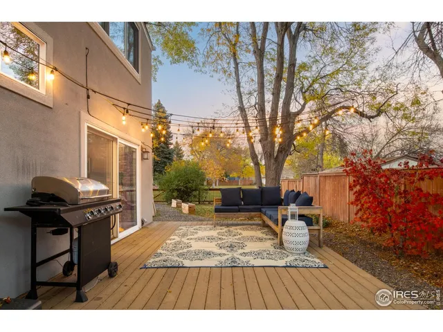 a living room with furniture and a kitchen view