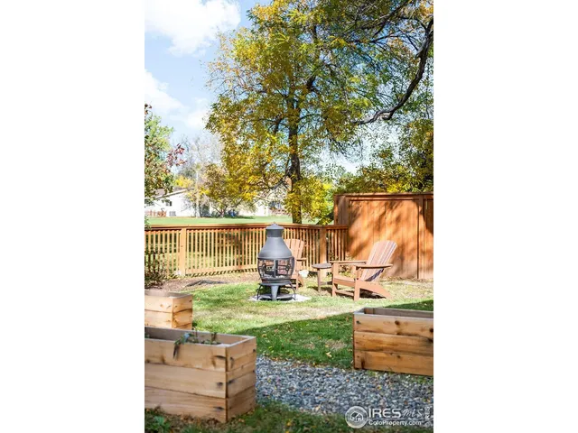 a backyard of a house with barbeque oven