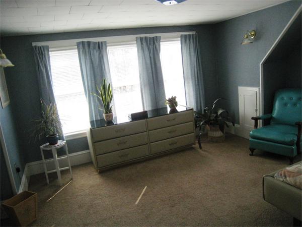 74 Madison Avenue Everett, MA 02149 - Photo 12 of 28 a living room with furniture and a large window