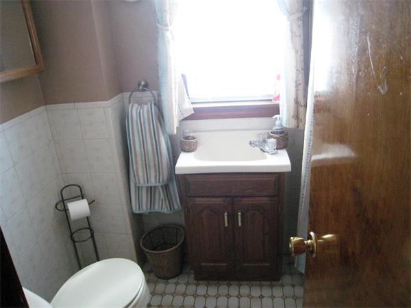74 Madison Avenue Everett, MA 02149 - Photo 16 of 28 a bathroom with a sink toilet and mirror