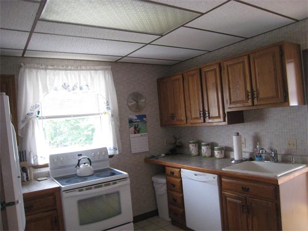 74 Madison Avenue Everett, MA 02149 - Photo 2 of 28 a kitchen with stainless steel appliances granite countertop a sink stove and cabinets