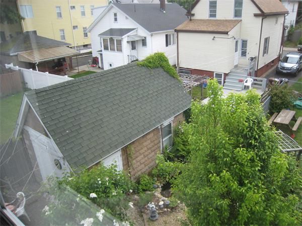 74 Madison Avenue Everett, MA 02149 - Photo 22 of 28 an aerial view of a house with a yard and large tree