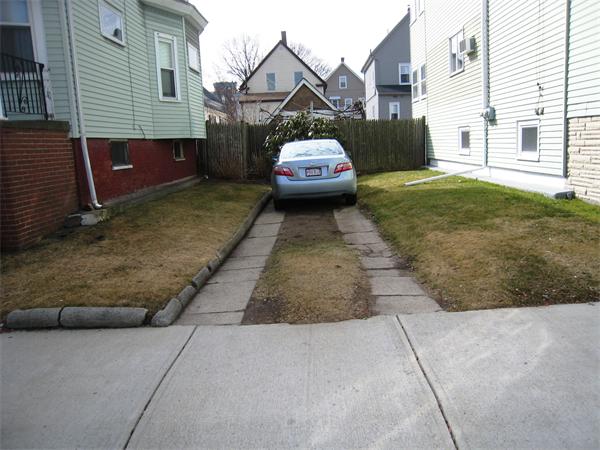 74 Madison Avenue Everett, MA 02149 - Photo 24 of 28 a view of a house with a back yard