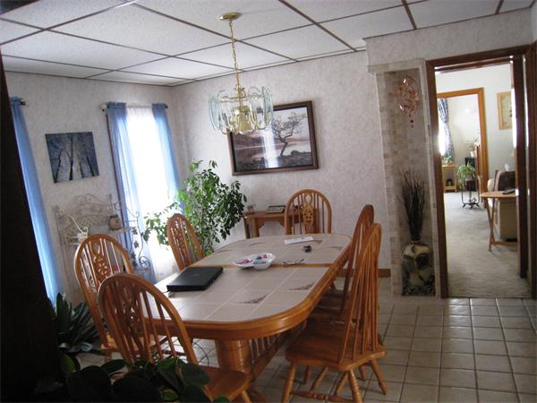 74 Madison Avenue Everett, MA 02149 - Photo 5 of 28 a view of a dining room with furniture and chandelier