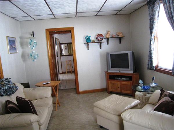 74 Madison Avenue Everett, MA 02149 - Photo 7 of 28 a living room with furniture and a flat screen tv