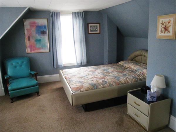 74 Madison Avenue Everett, MA 02149 - Photo 10 of 28 a bedroom with bed and a couch