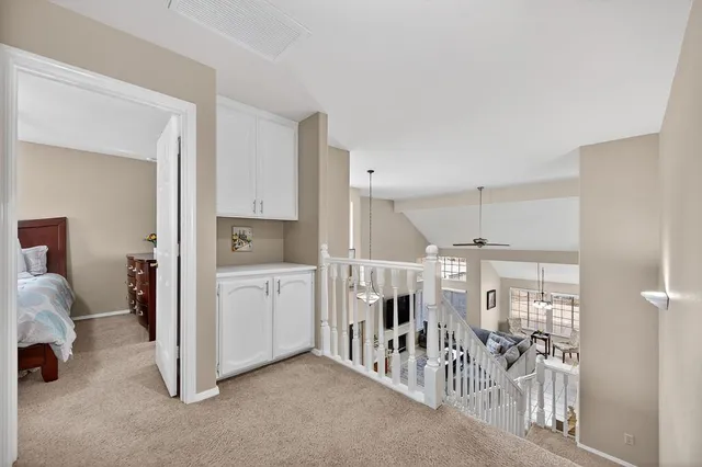 a bedroom with a bed and a television