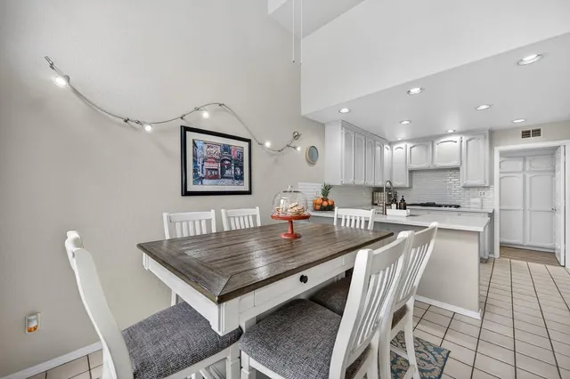 a kitchen with a table and chairs in it