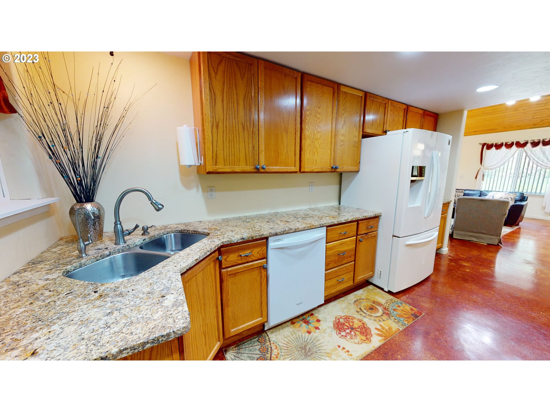13141 Driver Valley Road Oakland, OR 97462 - Photo 11 of 48 a kitchen with stainless steel appliances kitchen island granite countertop a refrigerator and sink