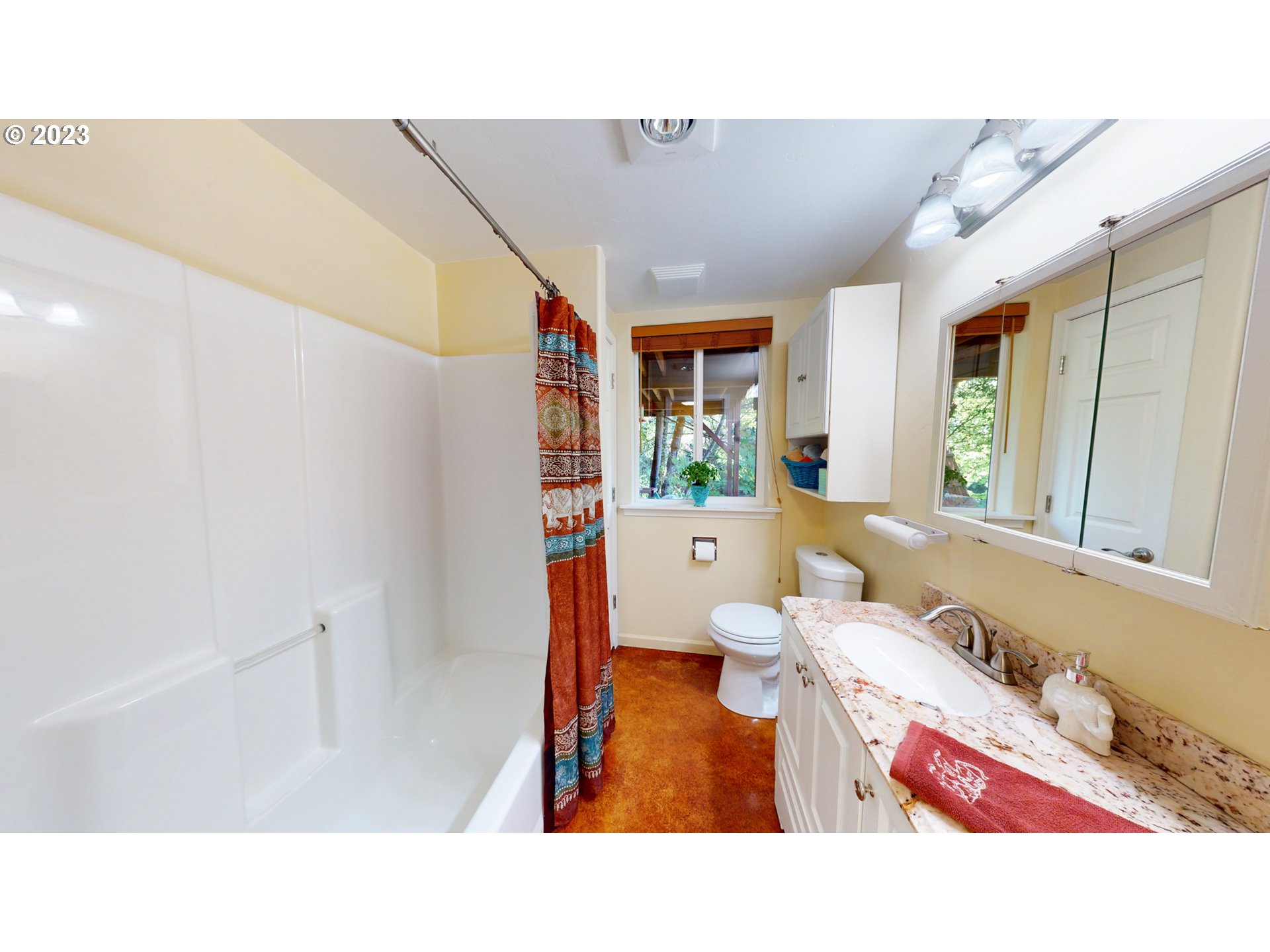 13141 Driver Valley Road Oakland, OR 97462 - Photo 13 of 48 a bathroom with a sink mirror and a bathtub