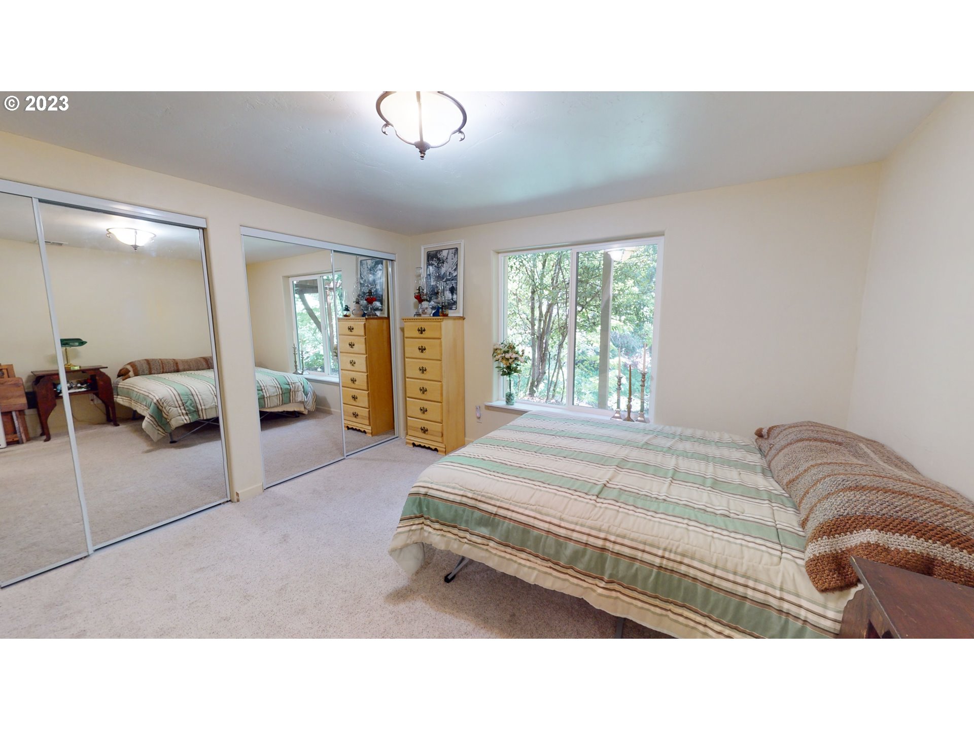 13141 Driver Valley Road Oakland, OR 97462 - Photo 15 of 48 a living room with a bed furniture and a large window