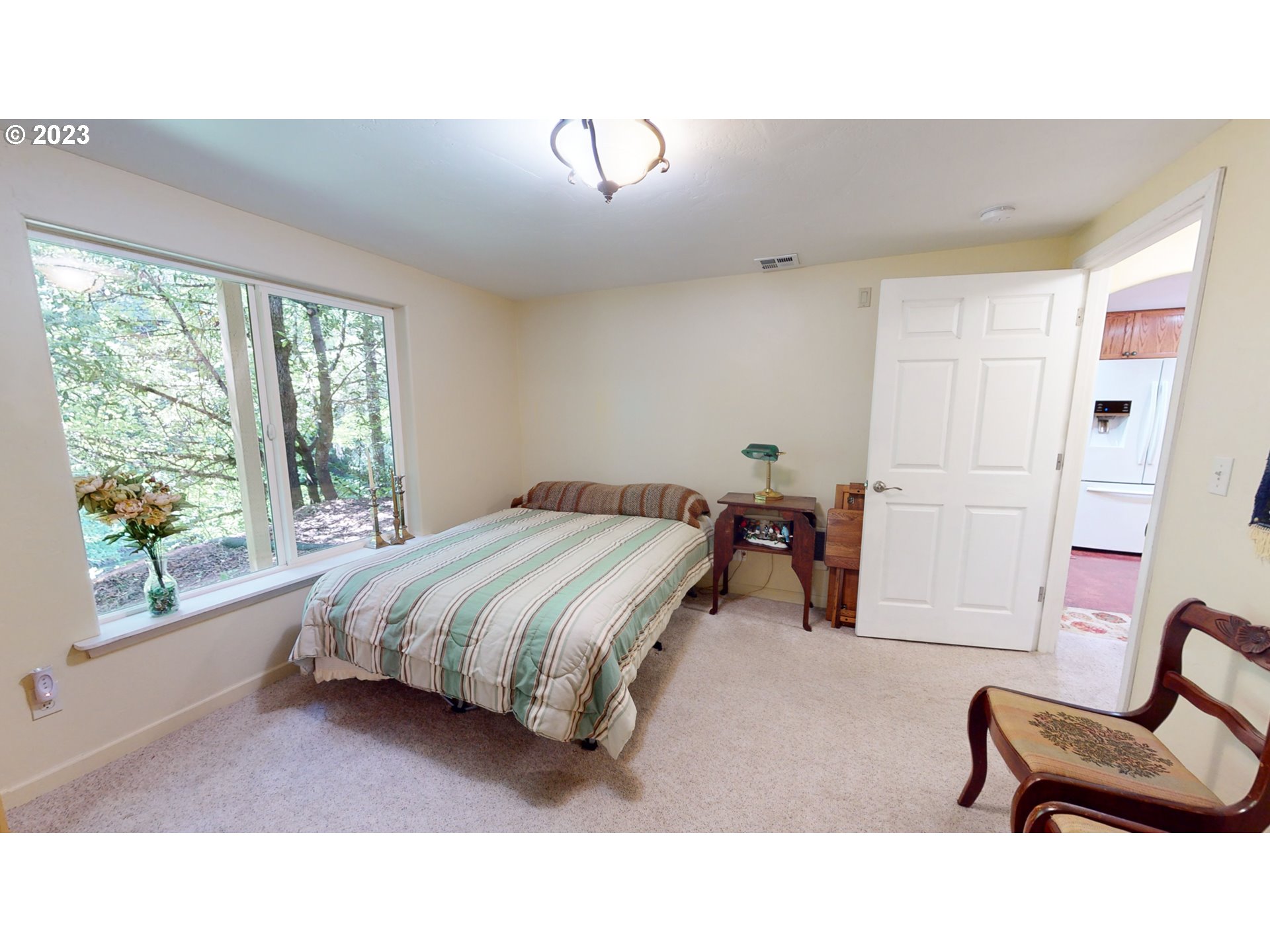 13141 Driver Valley Road Oakland, OR 97462 - Photo 16 of 48 a living room with a bed furniture and a large window
