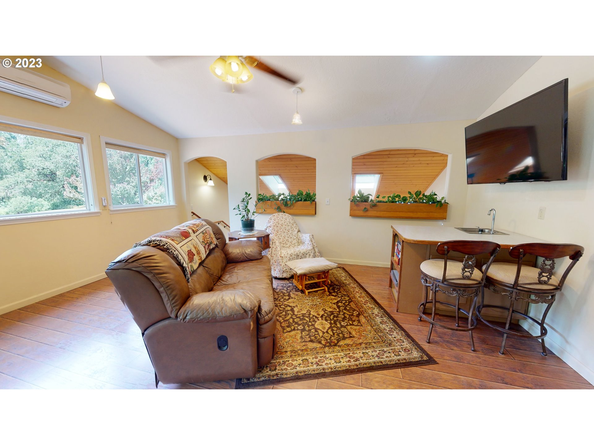 13141 Driver Valley Road Oakland, OR 97462 - Photo 21 of 48 a living room with furniture and a flat screen tv