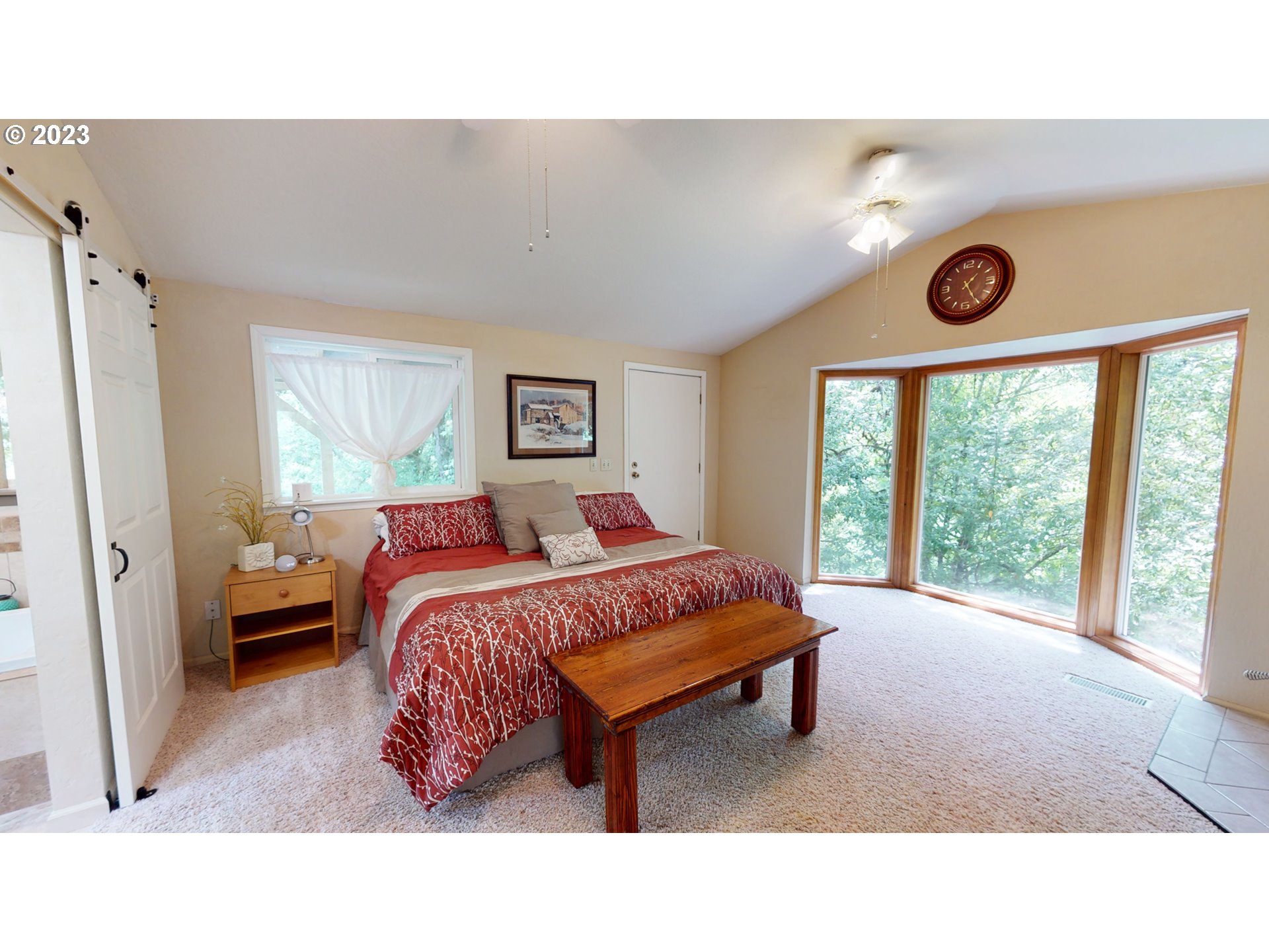 13141 Driver Valley Road Oakland, OR 97462 - Photo 25 of 48 a living room with a bed furniture and a large window