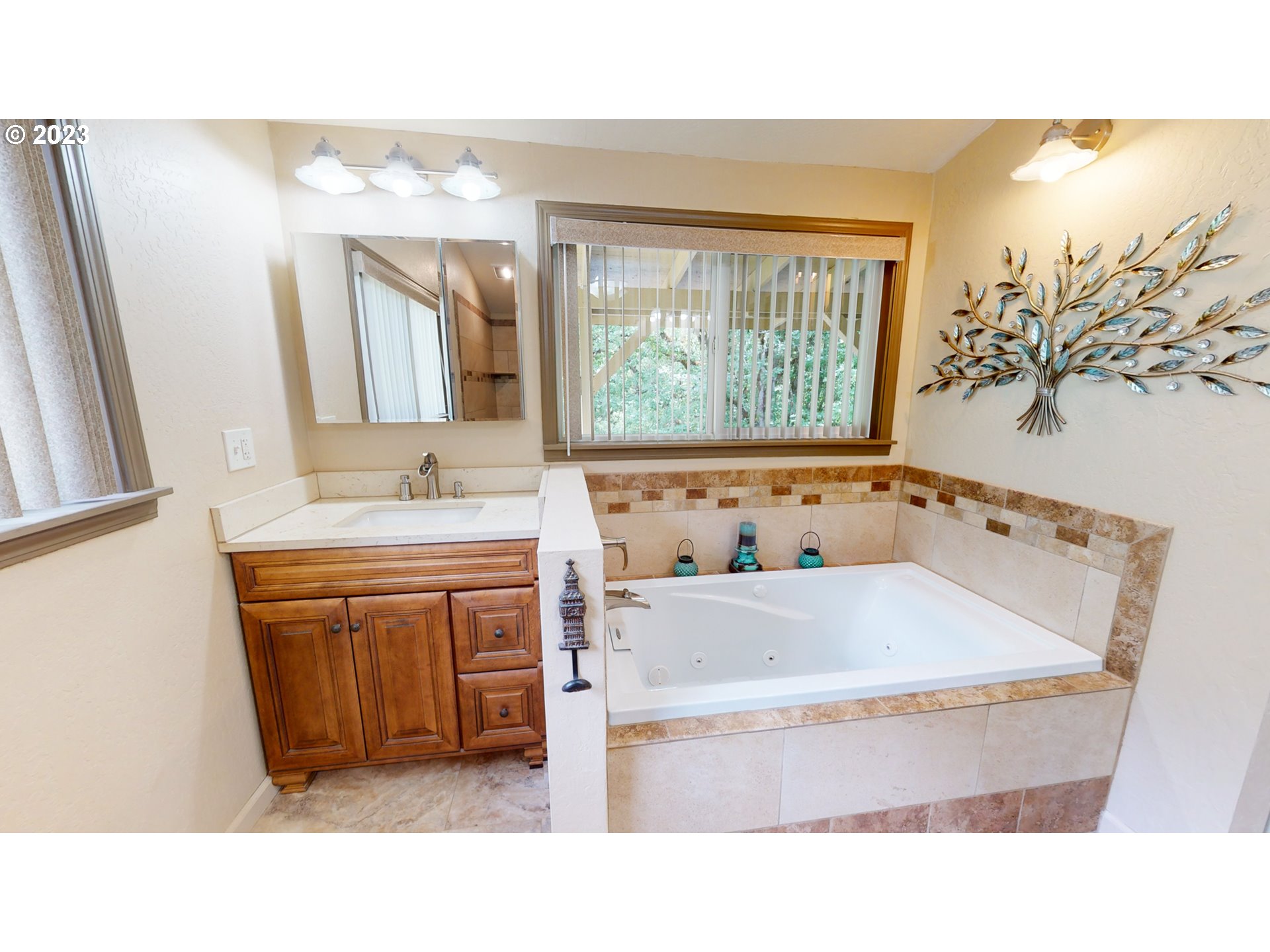13141 Driver Valley Road Oakland, OR 97462 - Photo 30 of 48 a bathroom with a tub sink and mirror