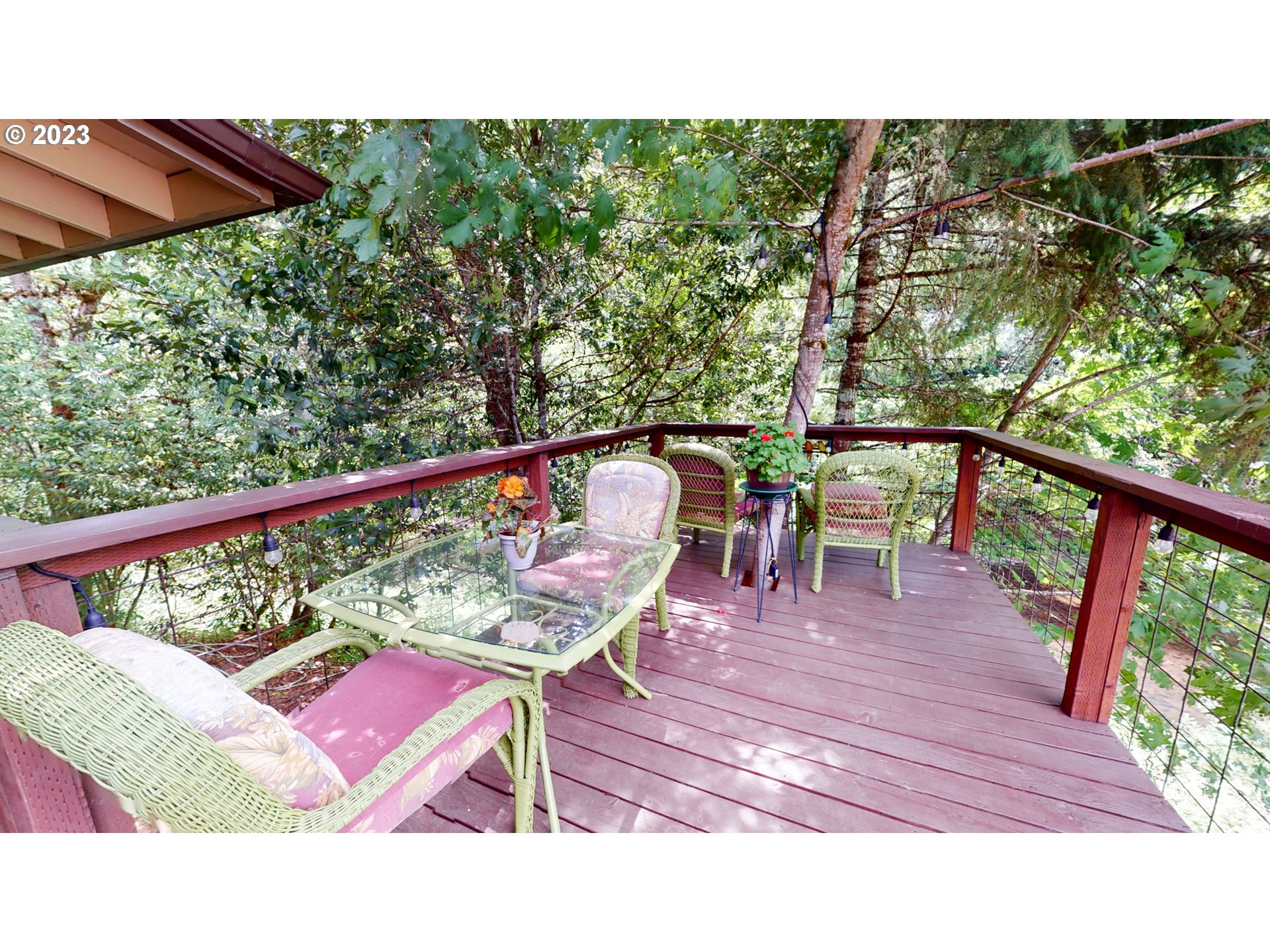 13141 Driver Valley Road Oakland, OR 97462 - Photo 34 of 48 a balcony with wooden floor and outdoor seating